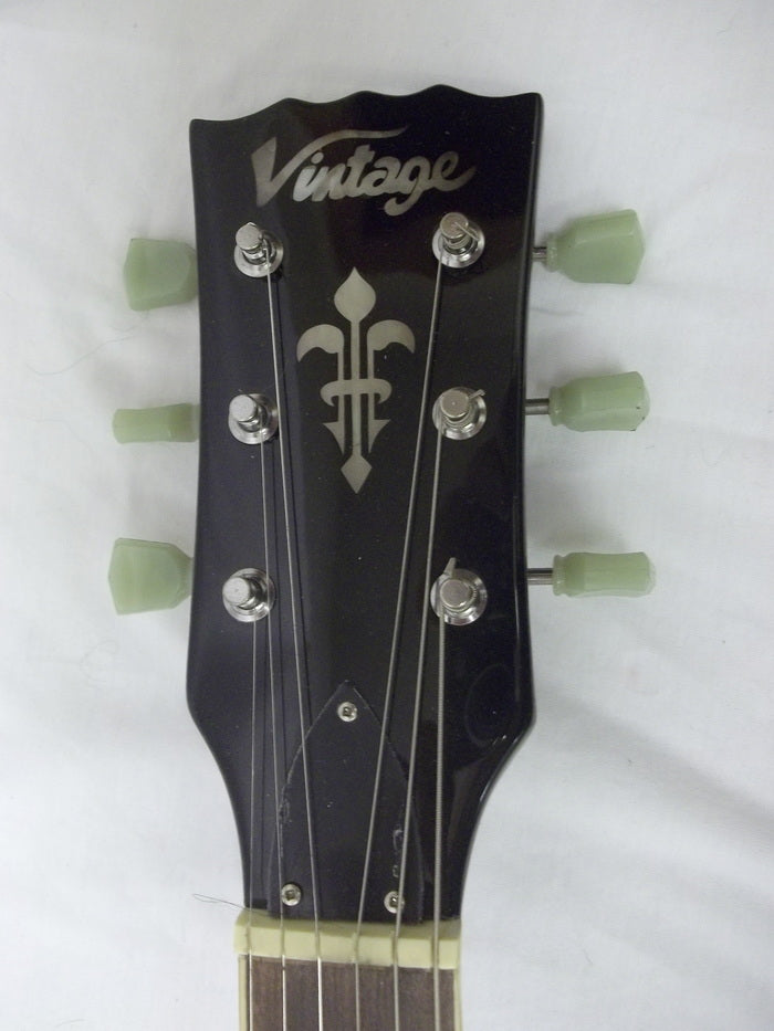 Left Hand: Vintage V100 SingleCut Electric Guitar